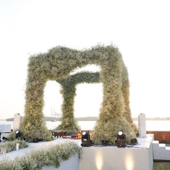 Bedecked with thousands of gypsos blooms, this waterside wedding mandap will take your breath away!