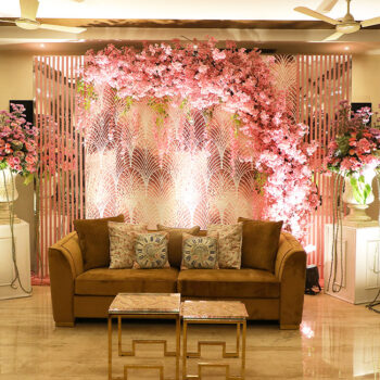 Pops of pink, red and lush floral setups made this couple’s home-based Roka ceremony a lively one!