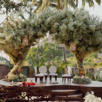 This couple’s unique nature-inspired wedding mandap featured two intertwining trees adorned with clouds of gypsos!