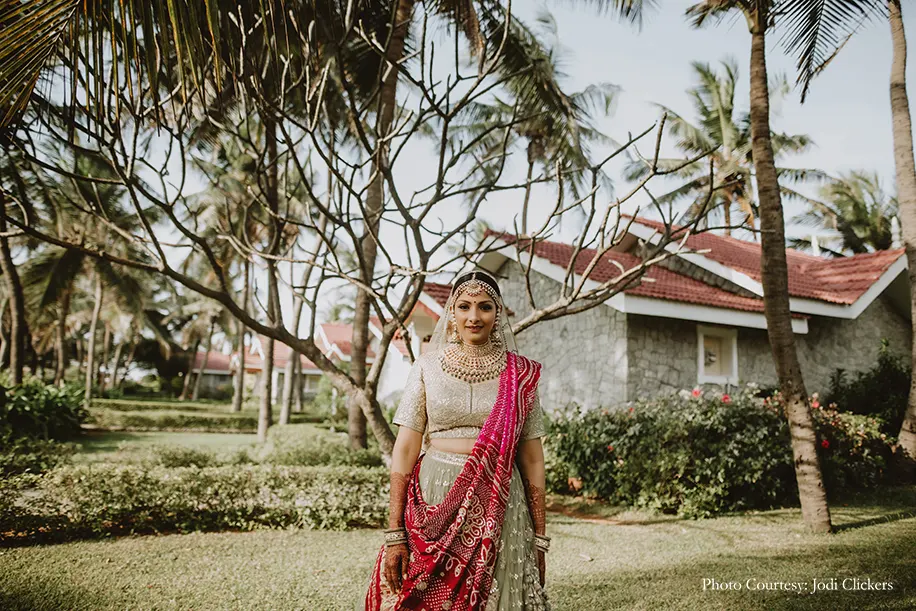 Bride wearing pastel green lehenga by Faabiiana