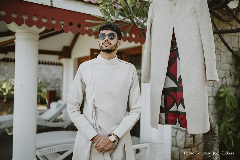 Groom wearing Off-white sherwani by Shantanu and Nikhil